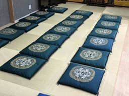 Cushions on the floor for guests to sit on and watch from