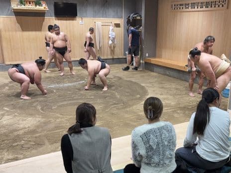 Sumo wrestlers practice and exercise in the ring